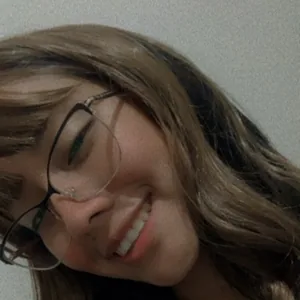 A woman smiling during a live video chat on Joi