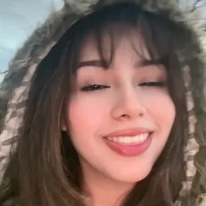 A member smiling into the camera on Joi