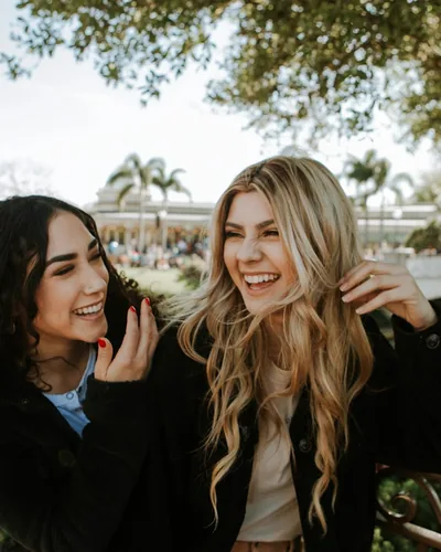 Two friends outdoors on a bright day